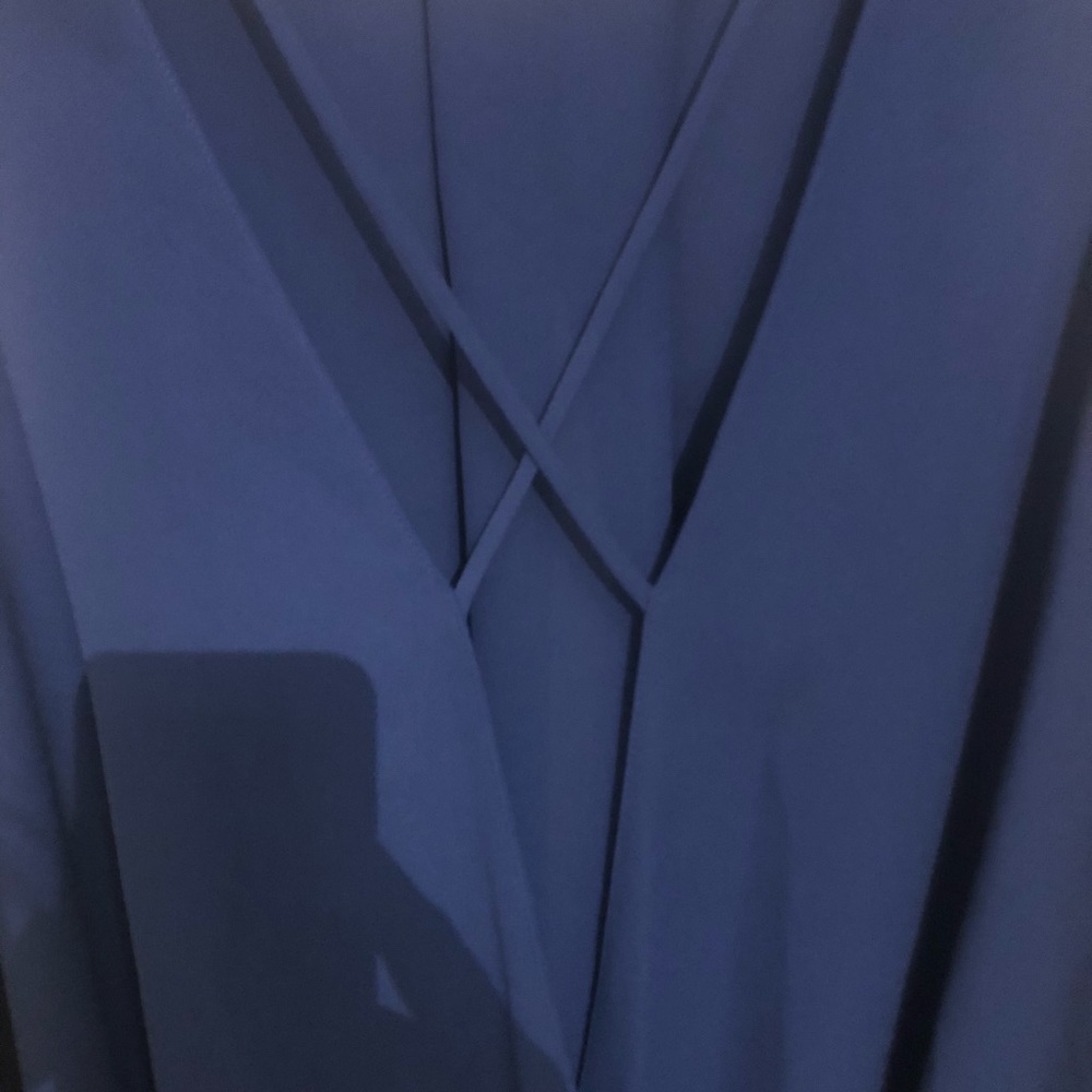 Blue criss cross v neck blouse